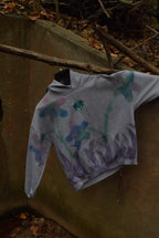 Grazing Cow in Field of Flowers Hoodie