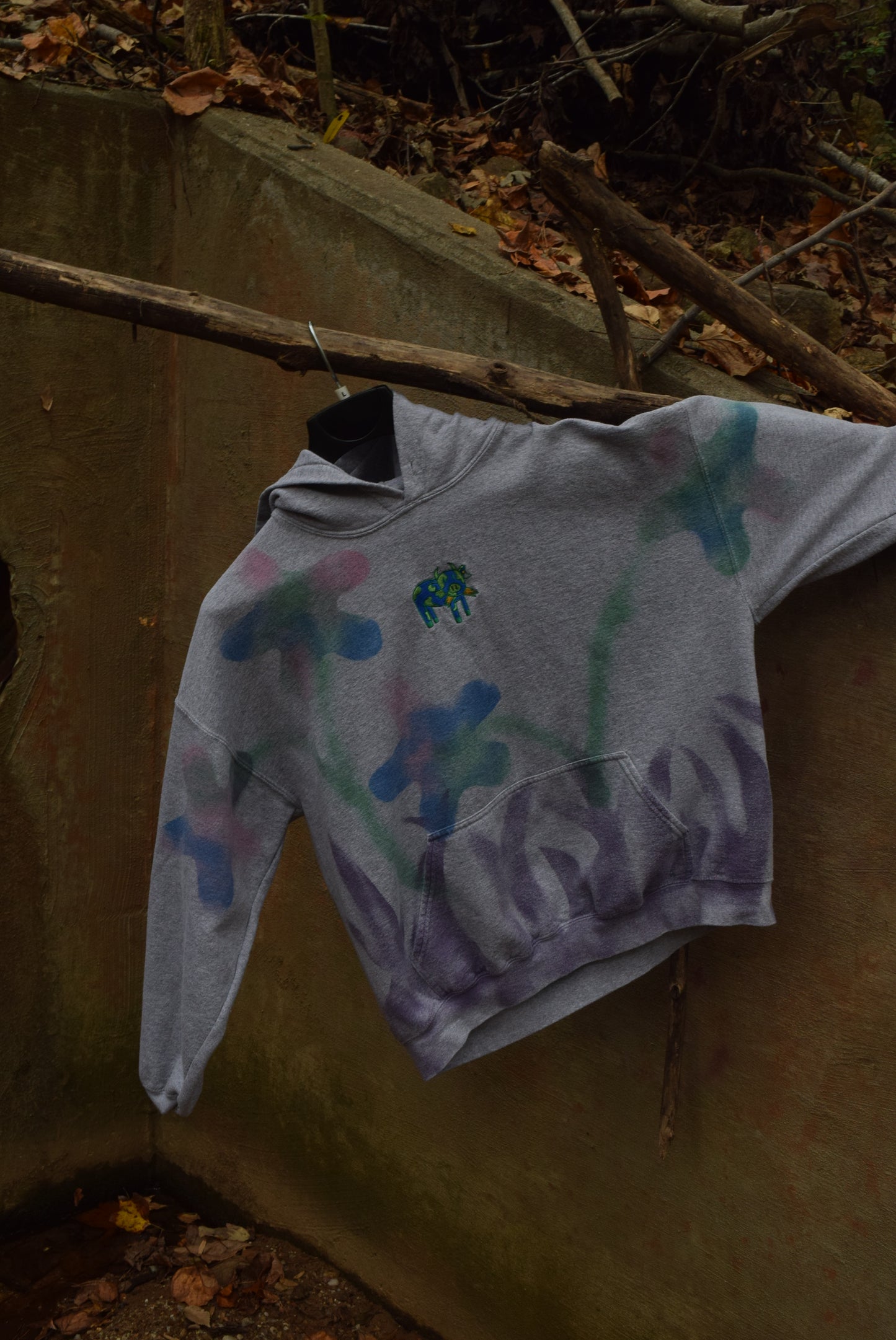 Grazing Cow in Field of Flowers Hoodie